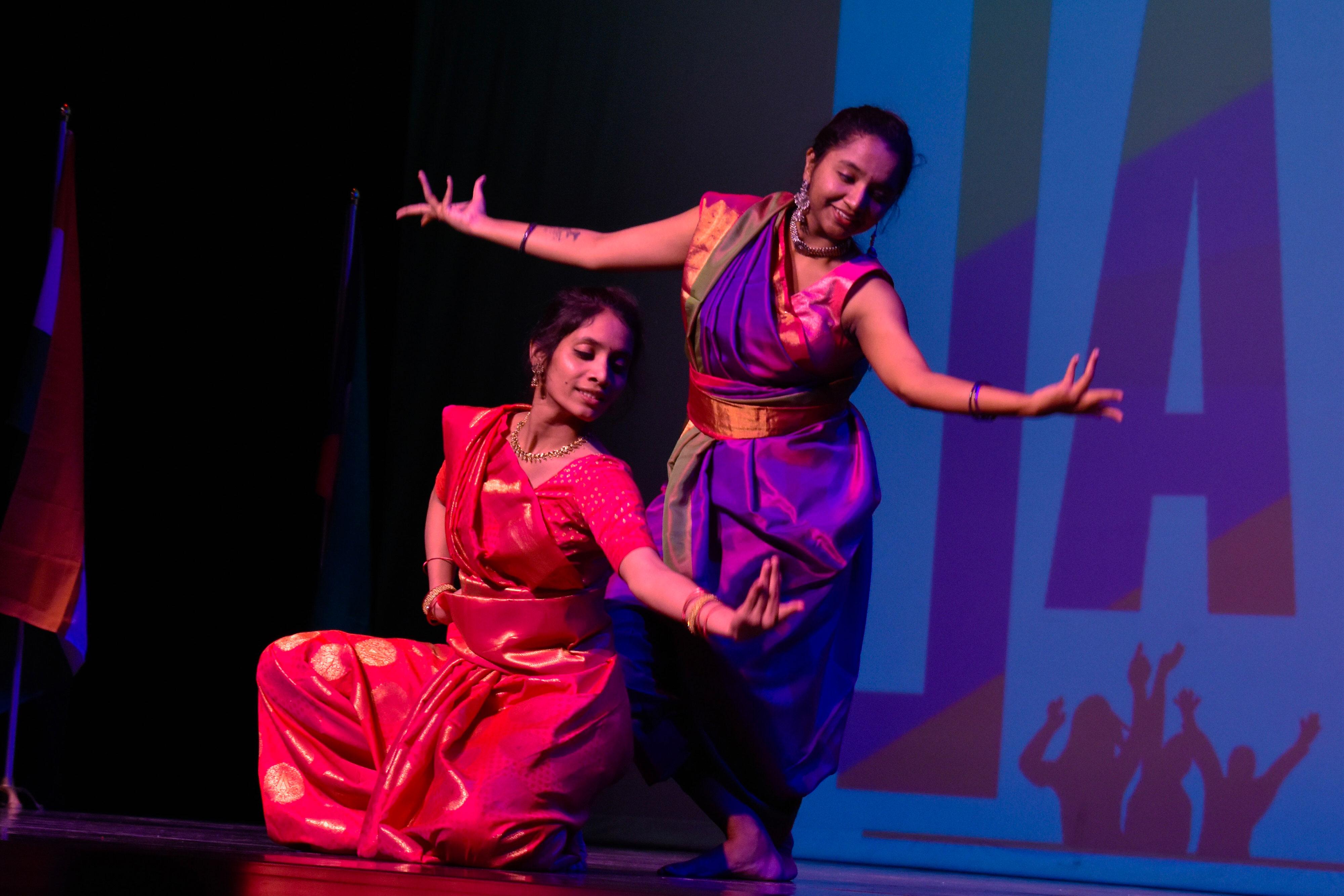 Two students dance at the International Festival